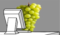 a drawing of a bunch of grapes in front of a computer