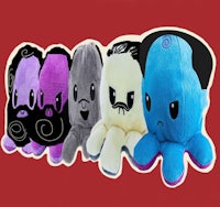 four octopus stuffed animals are lined up on a red background