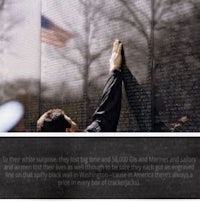 a man is reaching out to the wall of the vietnam war memorial