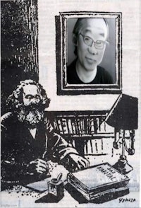 a picture of a man with glasses sitting at a desk