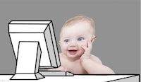 a baby sitting in front of a computer screen